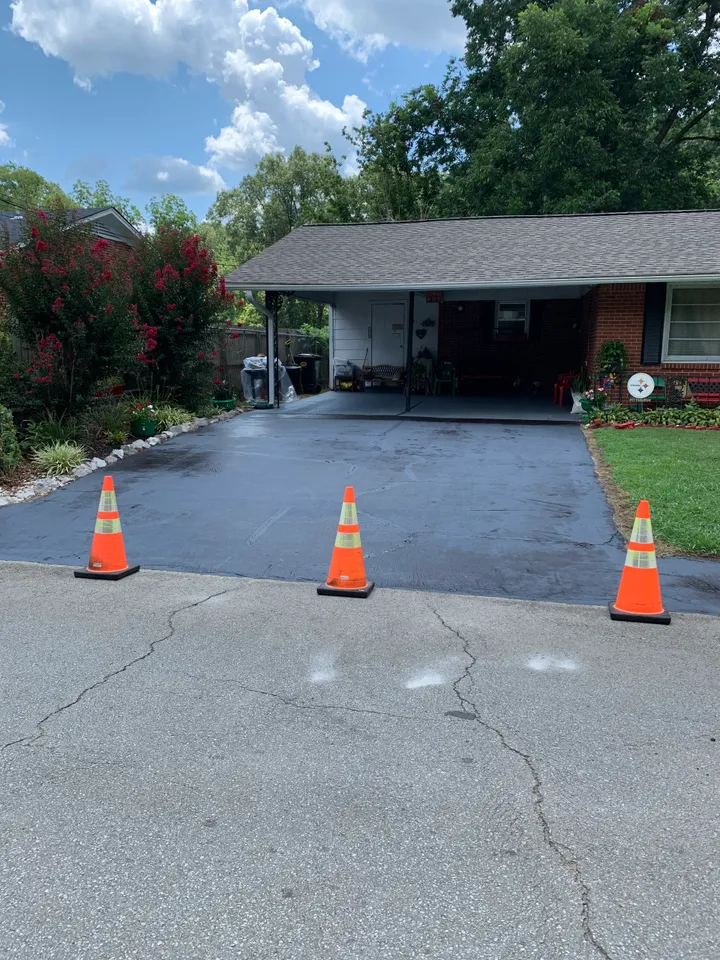 Hot-pour crack sealing on an asphalt surface