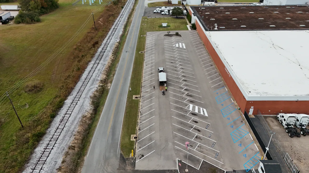 New parking lot line striping on sealed asphalt